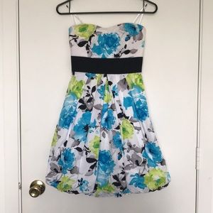 Strapless white floral dress with black tie